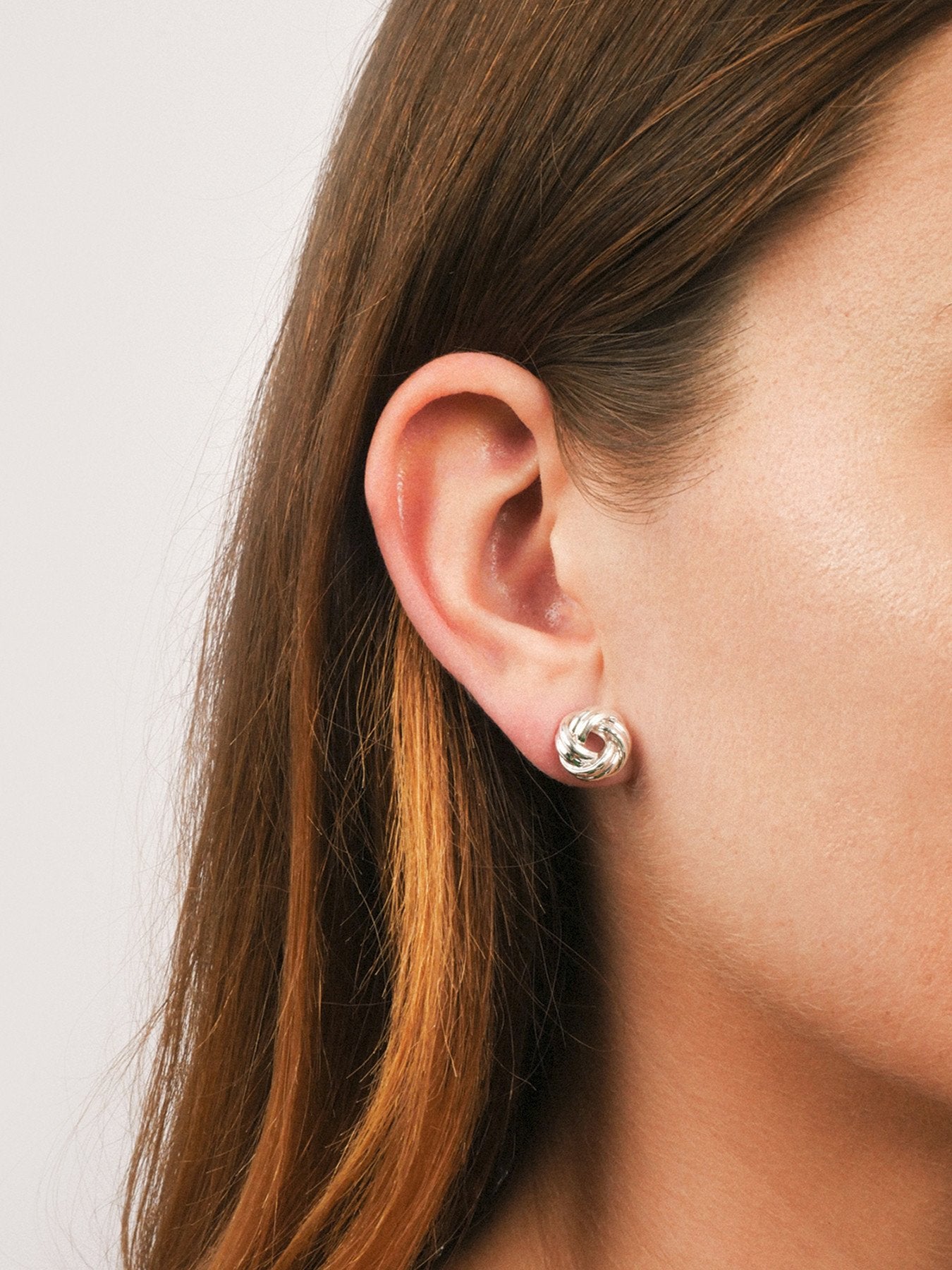 Gold Tone Knot Stud Earrings